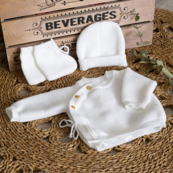 White baby bra with booties and hat